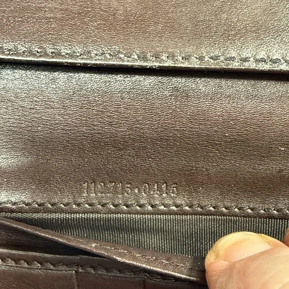 Gucci Dark Brown Embossed Clutch wallet inside is clean. GUC much life left!